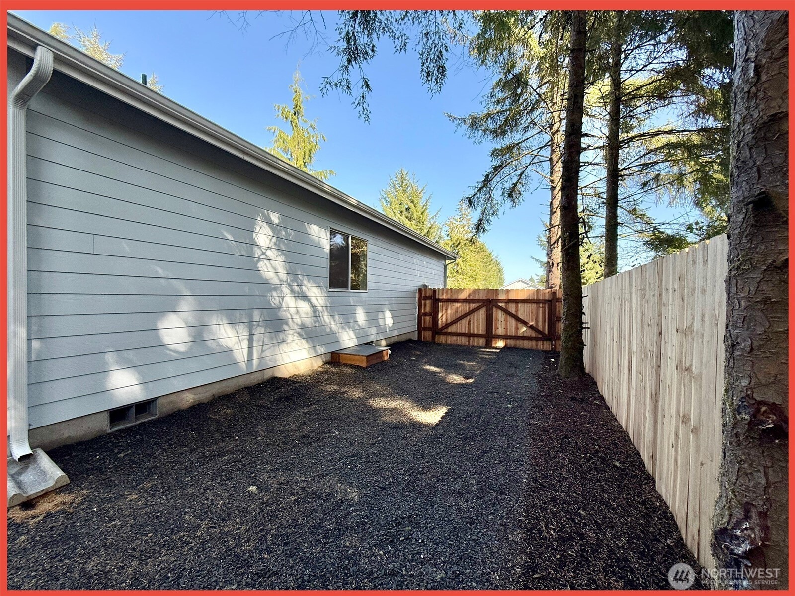 611 Weatherwax Loop Northeast Ocean Shores, WA 98569 - Photo 10 of 39 a view of a house with backyard and trees