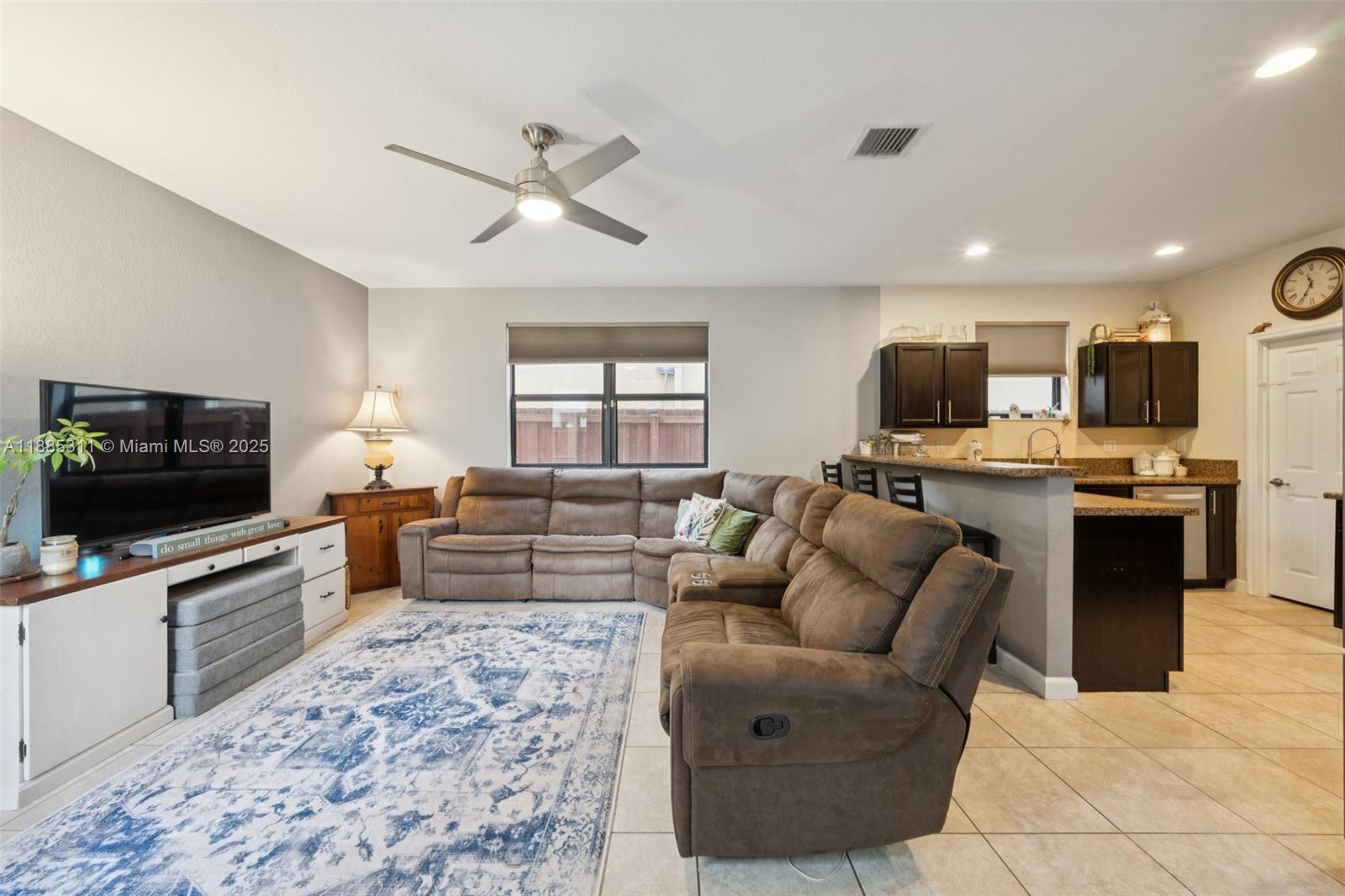 627 Southeast 34th Avenue Homestead, FL 33033 - Photo 3 of 17 a living room with furniture and a flat screen tv