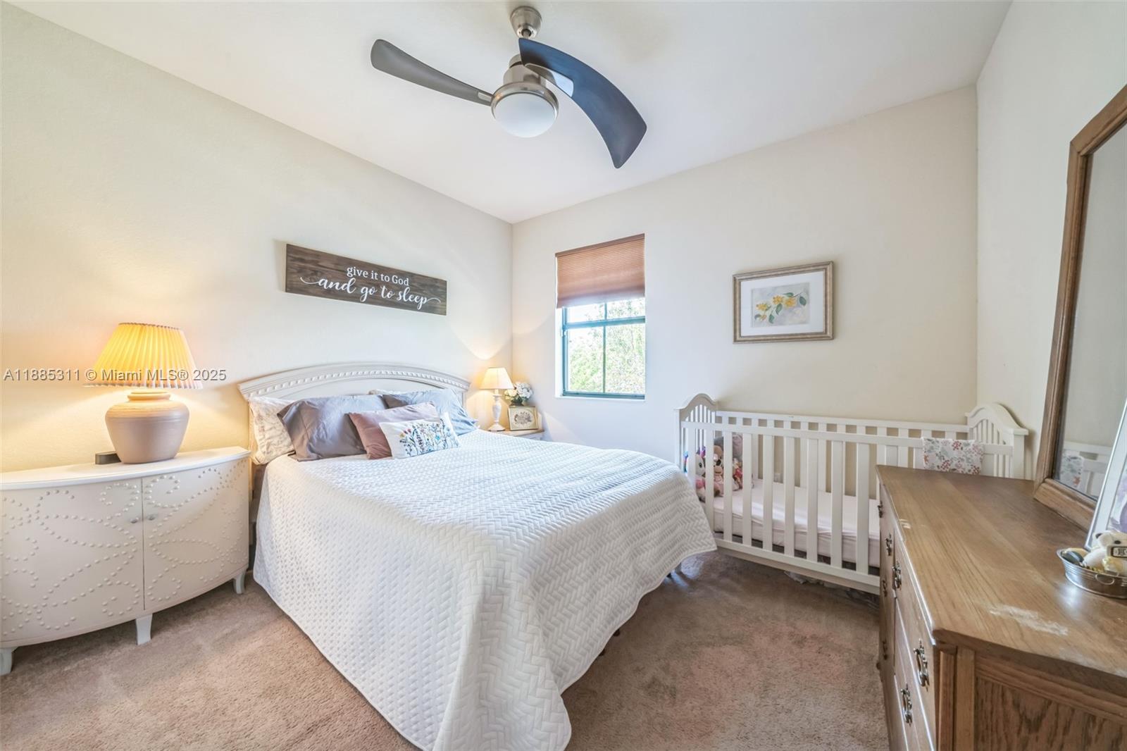 627 Southeast 34th Avenue Homestead, FL 33033 - Photo 10 of 17 a bedroom with a bed and a window