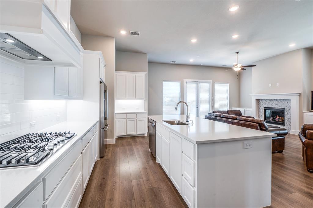 2901 Quinton Street Prosper, TX 75078 - Photo 13 of 24 a kitchen with sink stove and refrigerator