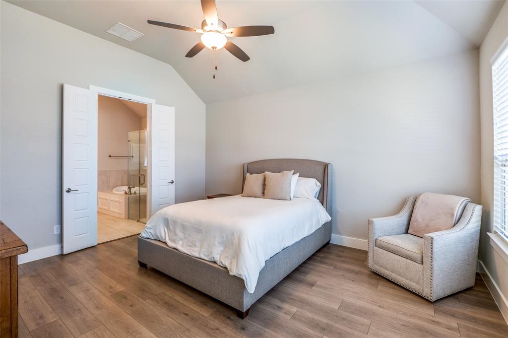 2901 Quinton Street Prosper, TX 75078 - Photo 14 of 24 a bedroom with a bed and a couch