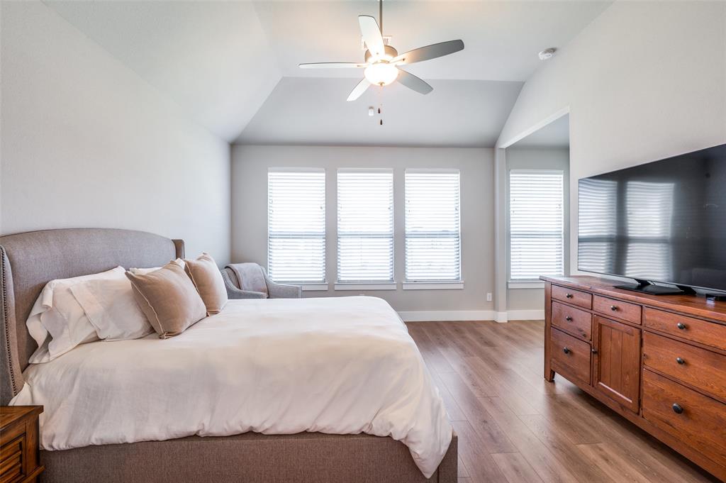 2901 Quinton Street Prosper, TX 75078 - Photo 15 of 24 a bedroom with a bed and a flat screen tv