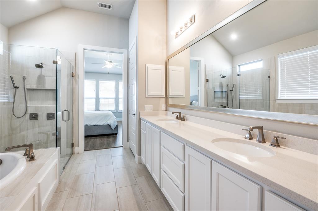 2901 Quinton Street Prosper, TX 75078 - Photo 18 of 24 a spacious bathroom with a double vanity sink mirror and shower