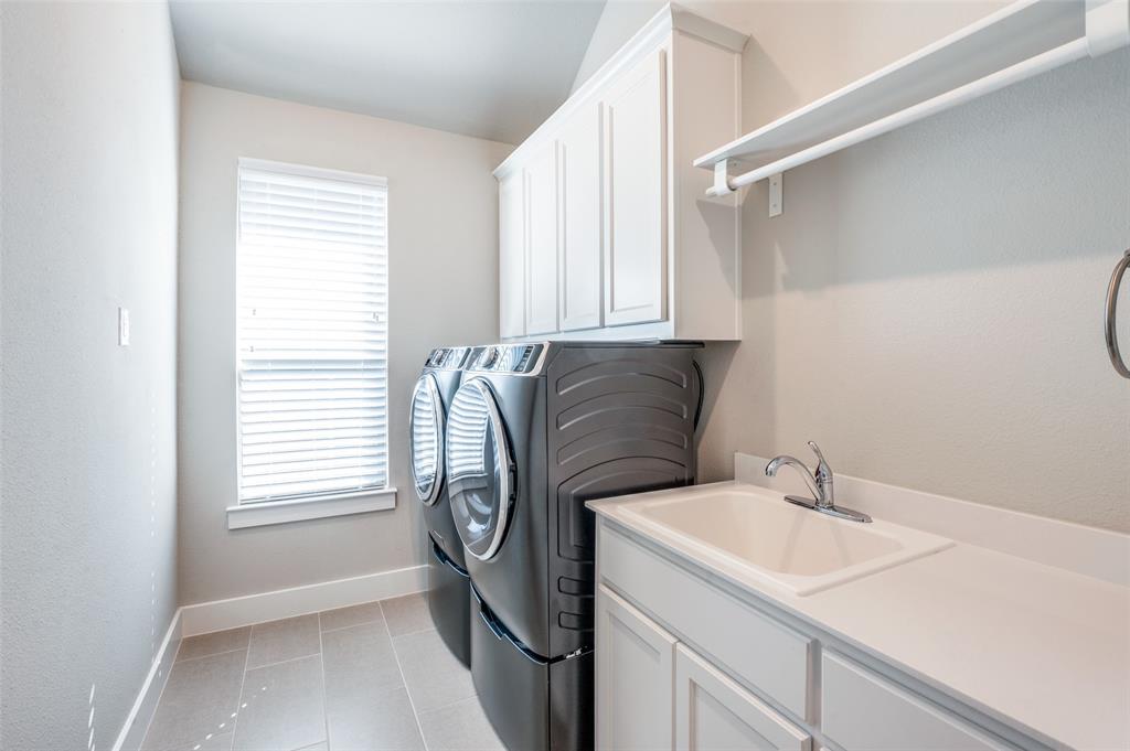 2901 Quinton Street Prosper, TX 75078 - Photo 19 of 24 a utility room with a sink dryer and washer