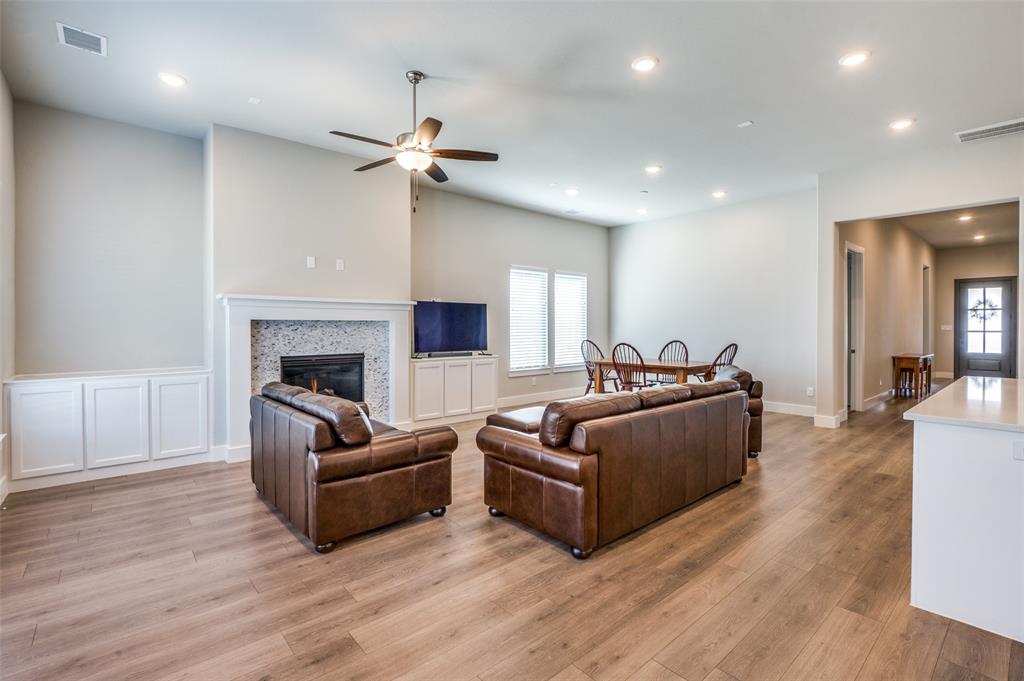 2901 Quinton Street Prosper, TX 75078 - Photo 6 of 24 a living room with furniture and a fireplace