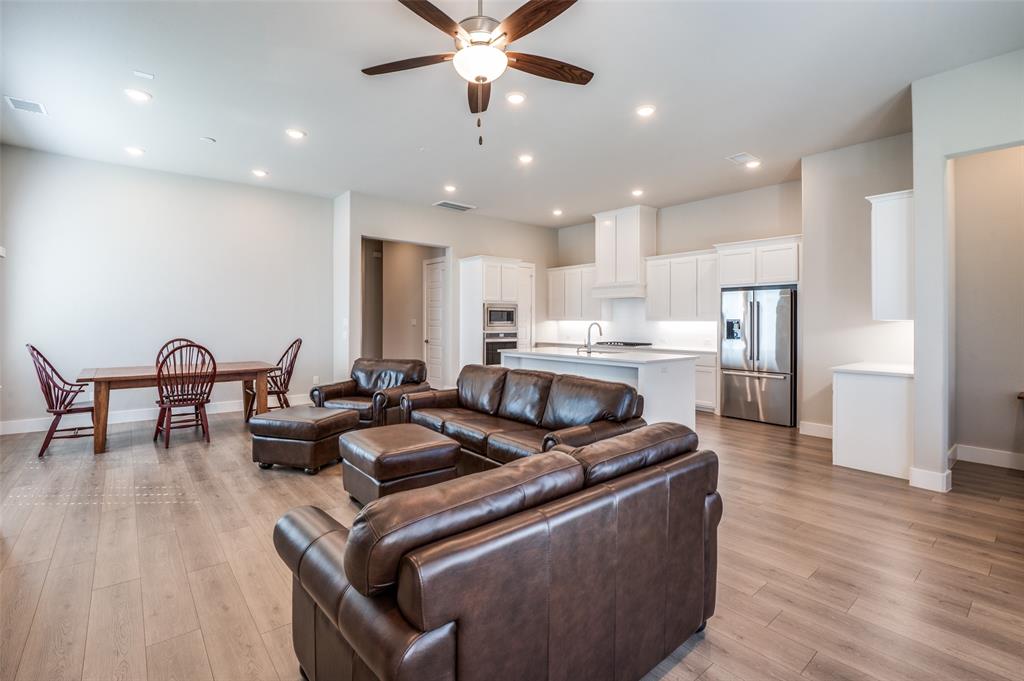 2901 Quinton Street Prosper, TX 75078 - Photo 8 of 24 a living room with furniture and kitchen view