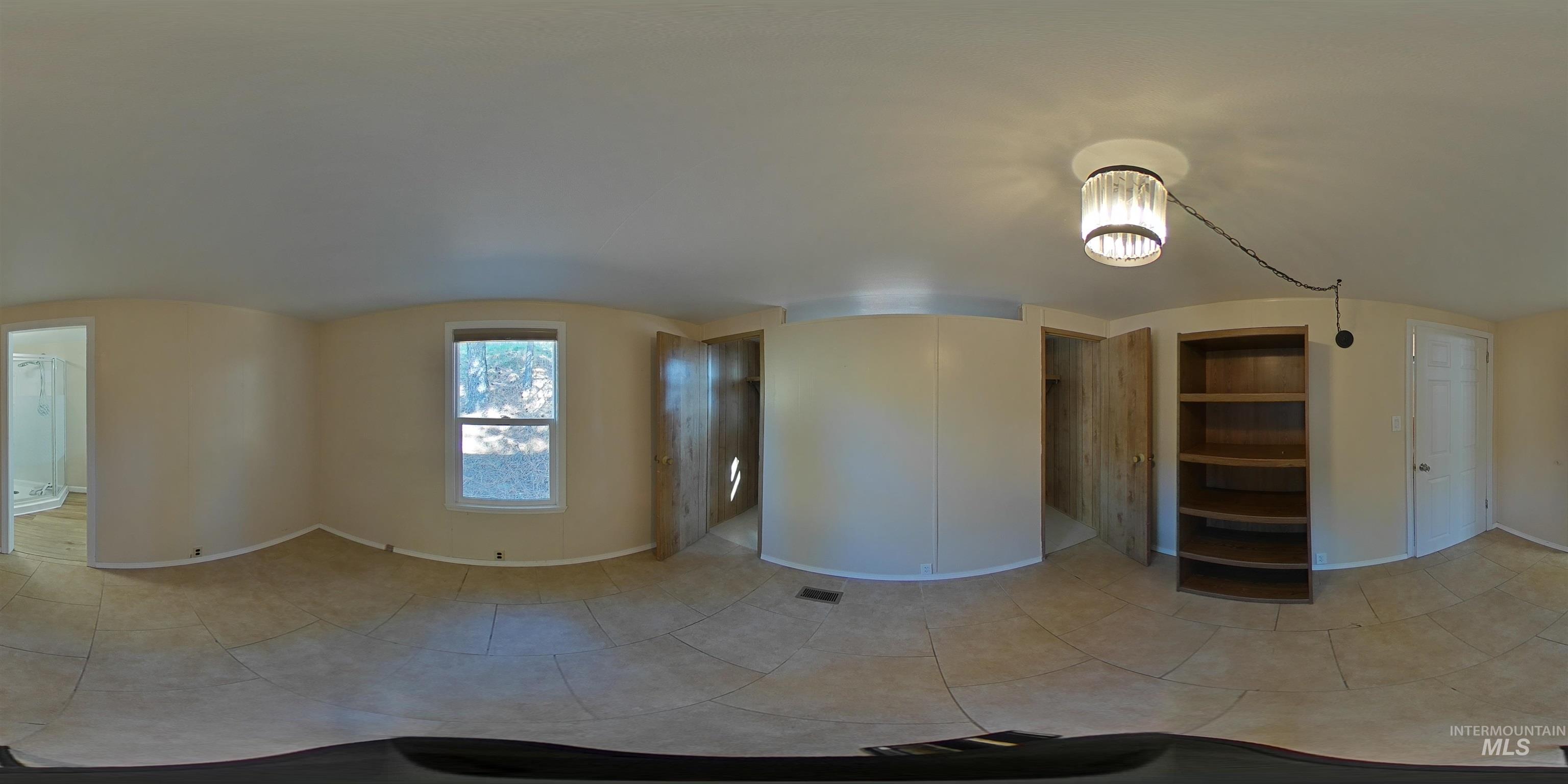 4099 Lakeview Road Orofino, ID 83544 - Photo 26 of 41 Recessed lighting, wood-finish shelving, and a window with natural light