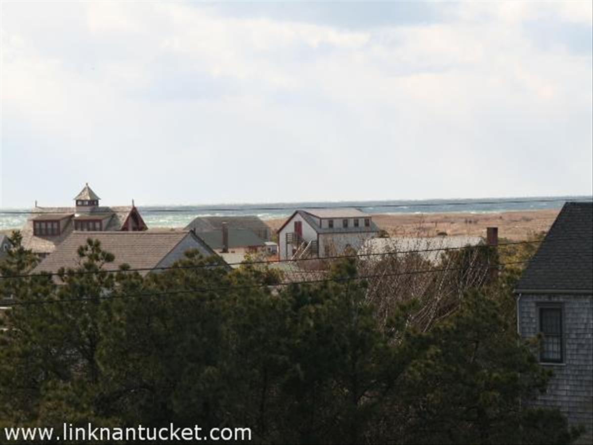 157 Surfside Road Nantucket, MA 02554 - Photo 4 of 6 a view of a lake with houses