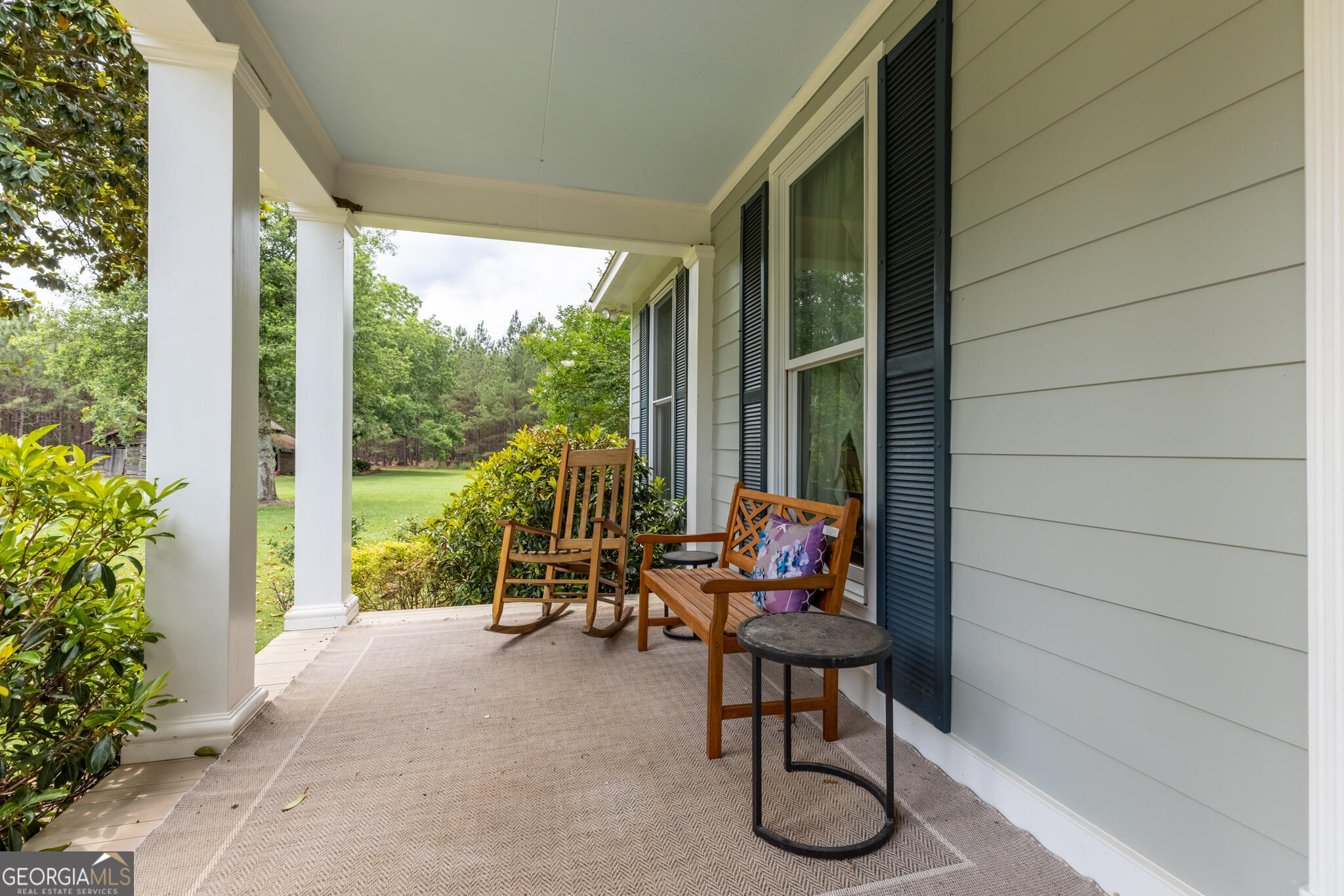 1859 Upper River Road Americus, GA 31709 - Photo 16 of 47 a living room with patio furniture and floor to ceiling window
