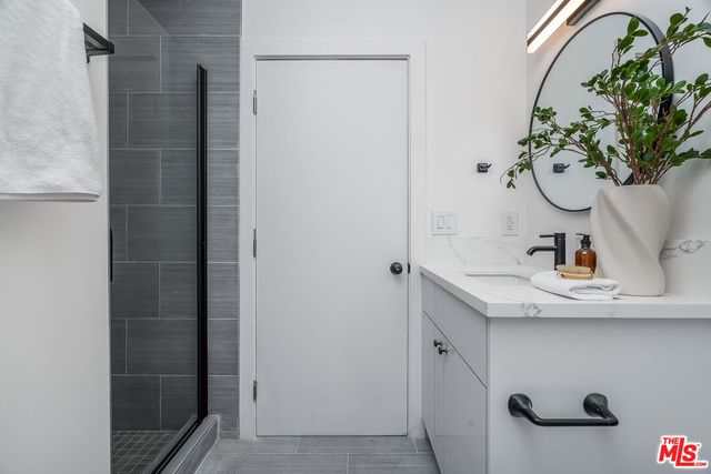 a bathroom with a sink and mirror