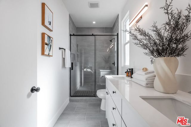 a bathroom with a bathtub sink and toilet