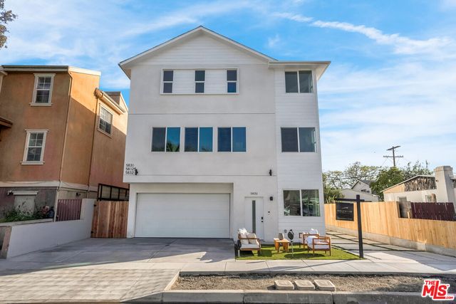 a front view of a house with street