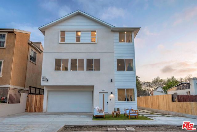 a front view of a house with street