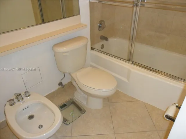 a bathroom with a toilet and a sink