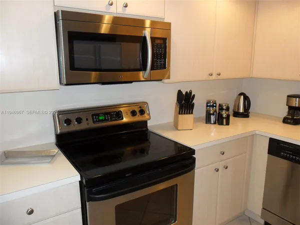 a kitchen with a stove and a microwave