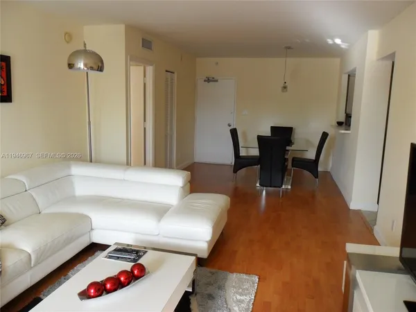 a living room with furniture and a table