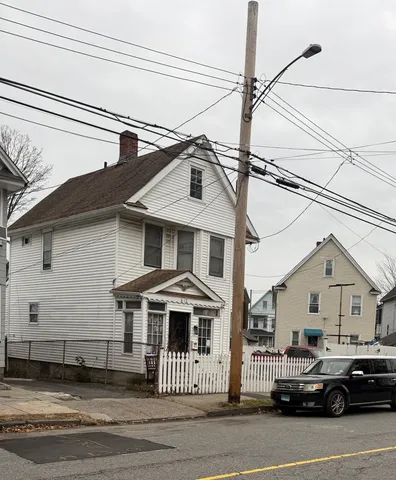 a front view of a house with a white house