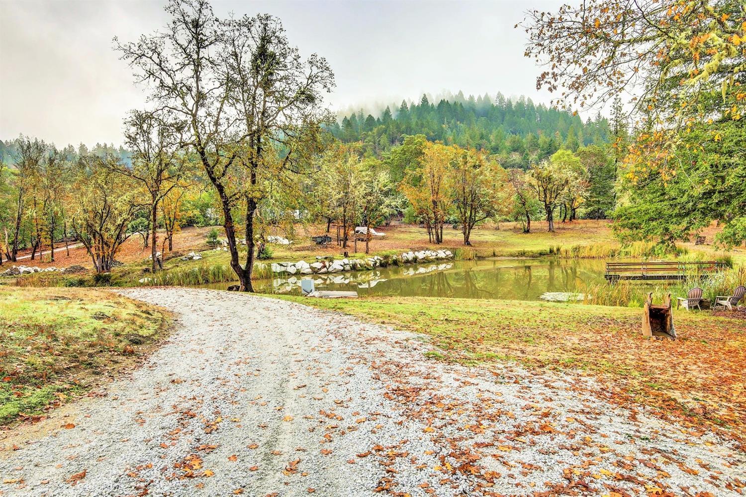 2655 Robertson Bridge Road Grants Pass, OR 97526 - Photo 10 of 31 a view of a lake with houses