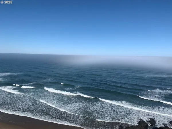 a view of a room with an empty space and window
