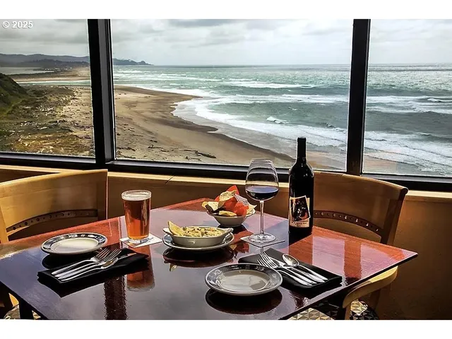a view of a room with furniture and floor to ceiling window