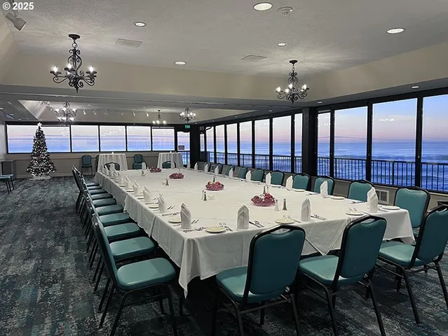 a large dining room with a table and chairs