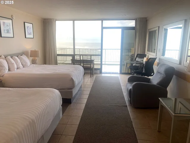 a en suite bedroom with a bed and a large window