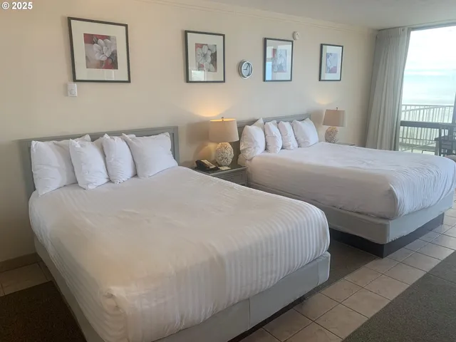 a bedroom with bed and a window