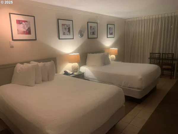 a bedroom with a bed and lamp