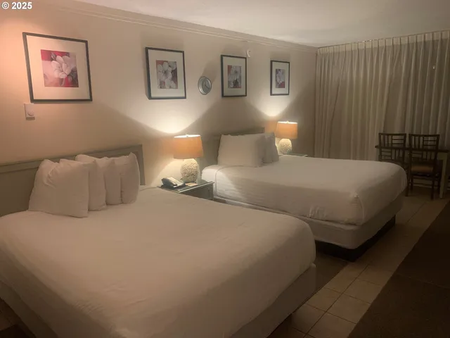 a bedroom with a bed and lamp