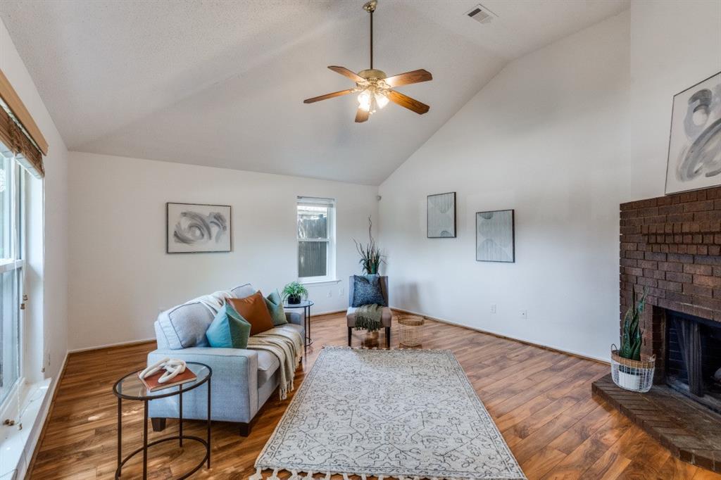 1509 Clover Drive Allen, TX 75002 - Photo 6 of 25 a living room with furniture and a fireplace