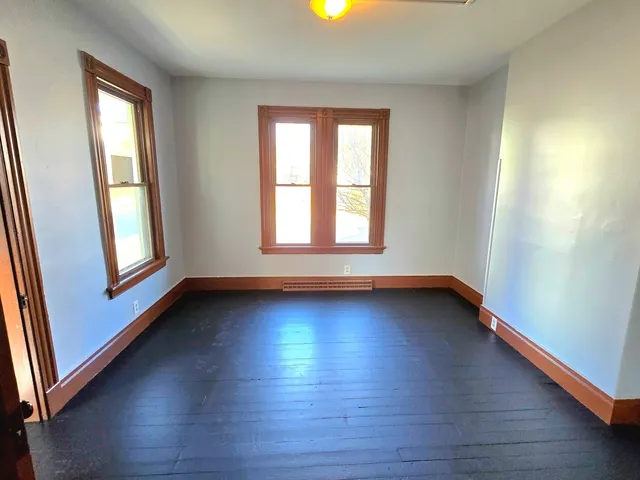 an empty room that has a window