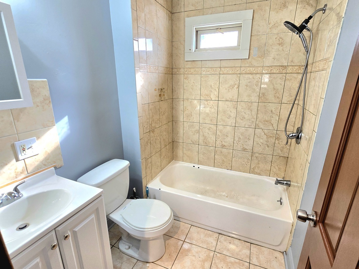 10 Clarkson Street Ansonia, CT 06401 - Photo 26 of 35 a bathroom with a sink toilet and shower