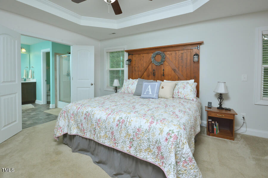 195 Timberwind Road Franklinton, NC 27525 - Photo 21 of 28 a bedroom with a bed and a painting on the wall