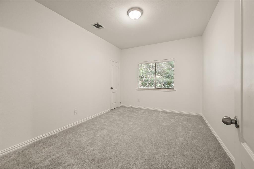 808 Briar Ridge Drive Keller, TX 76248 - Photo 22 of 40 Carpeted room featuring a window with blinds, a ceiling-mounted light fixture, and two panel doors