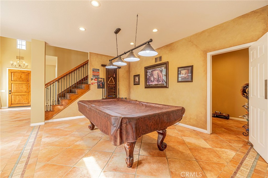 574 Oak Tree Court Simi Valley, CA 93065 - Photo 13 of 48 a room with table and stairs