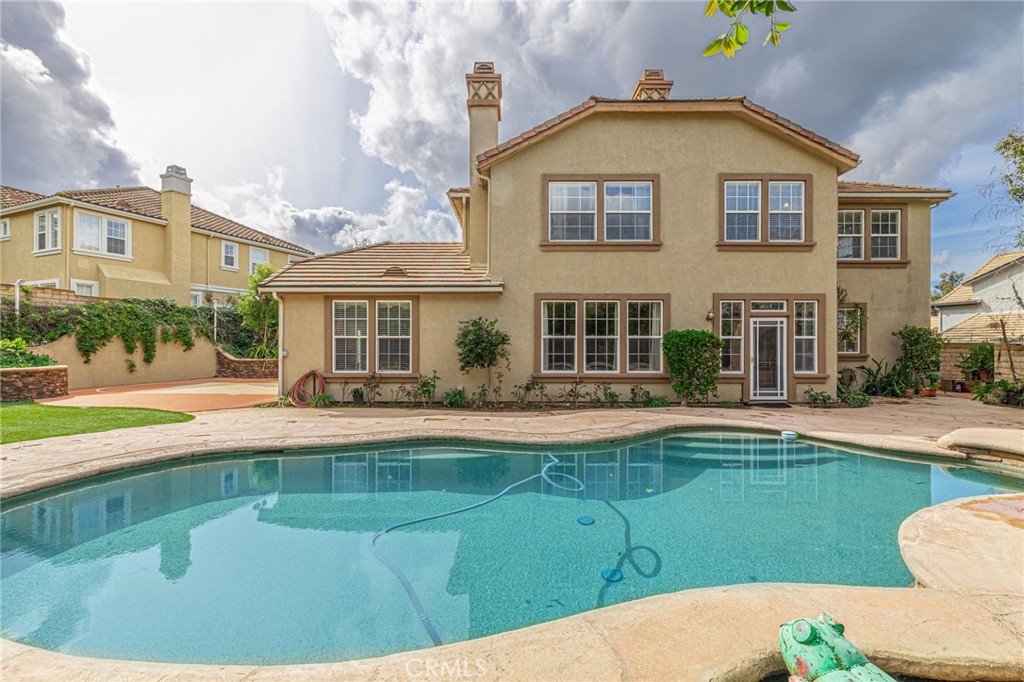 574 Oak Tree Court Simi Valley, CA 93065 - Photo 2 of 48 a view of house with a swimming pool