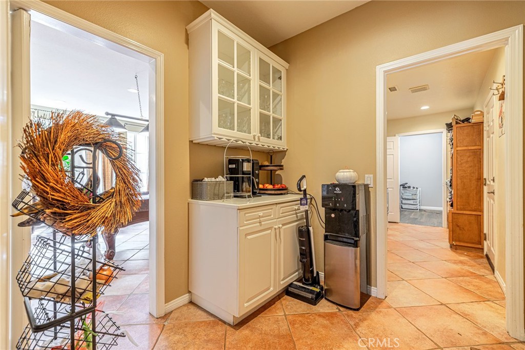 574 Oak Tree Court Simi Valley, CA 93065 - Photo 21 of 48 a kitchen with a refrigerator and a stove