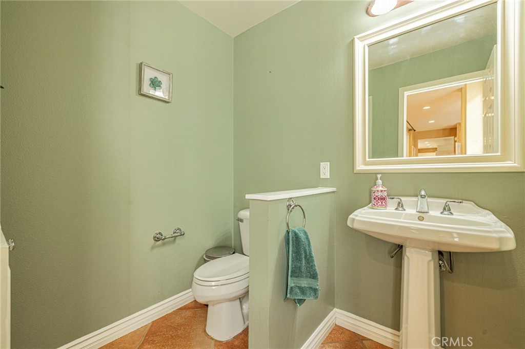 574 Oak Tree Court Simi Valley, CA 93065 - Photo 25 of 48 a bathroom with a sink and a toilet