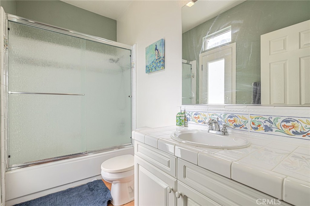 574 Oak Tree Court Simi Valley, CA 93065 - Photo 27 of 48 a bathroom with a sink a toilet and shower
