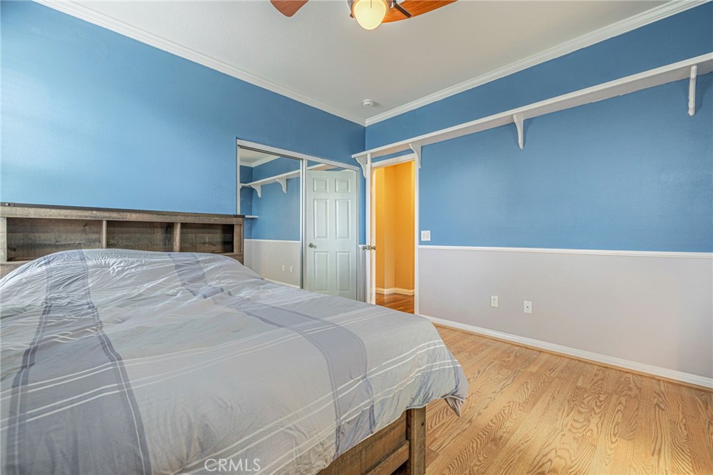 574 Oak Tree Court Simi Valley, CA 93065 - Photo 30 of 48 a bedroom with a large bed and a closet