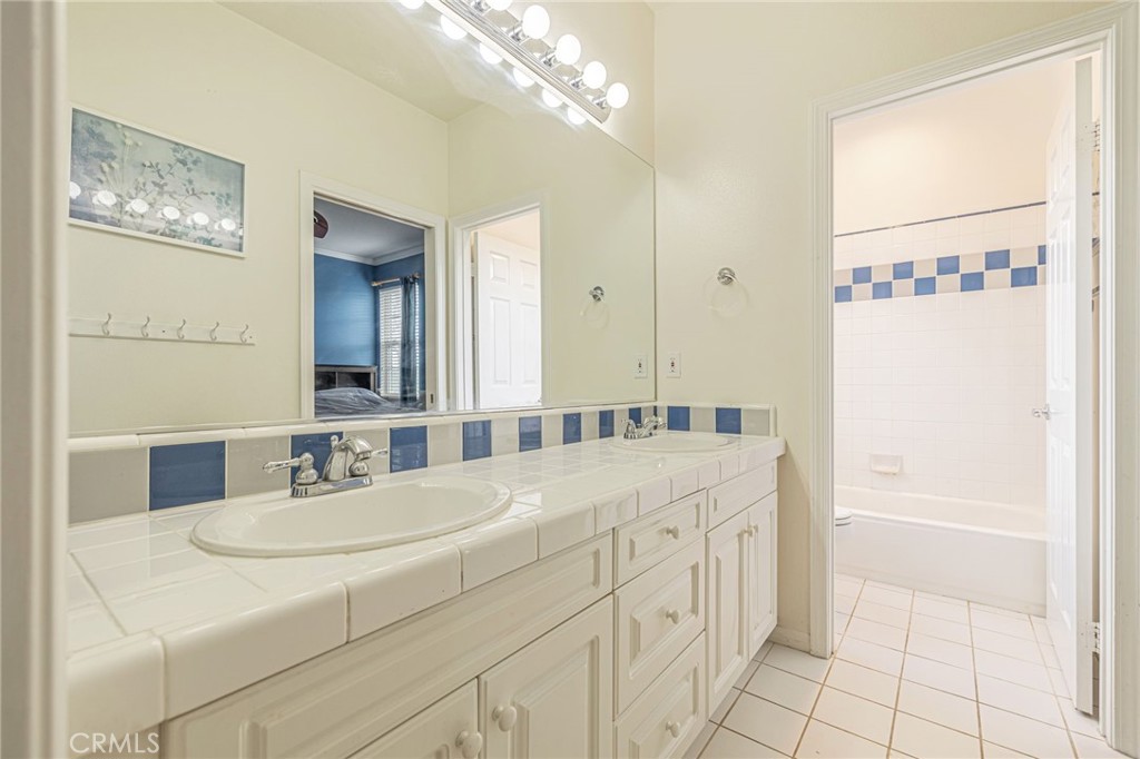 574 Oak Tree Court Simi Valley, CA 93065 - Photo 31 of 48 a bathroom with a sink a vanity and a mirror