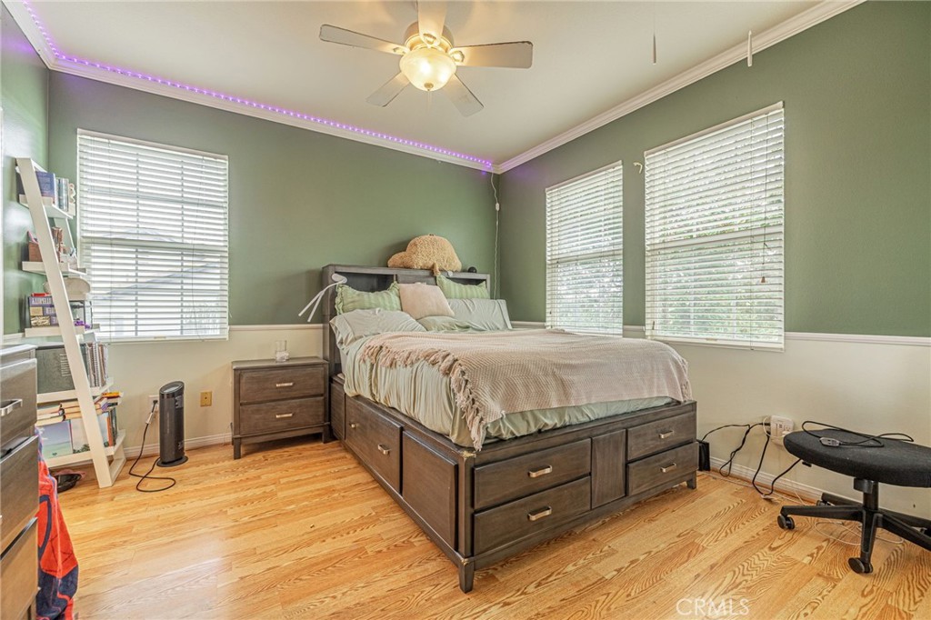 574 Oak Tree Court Simi Valley, CA 93065 - Photo 33 of 48 a bedroom with a bed and a chair