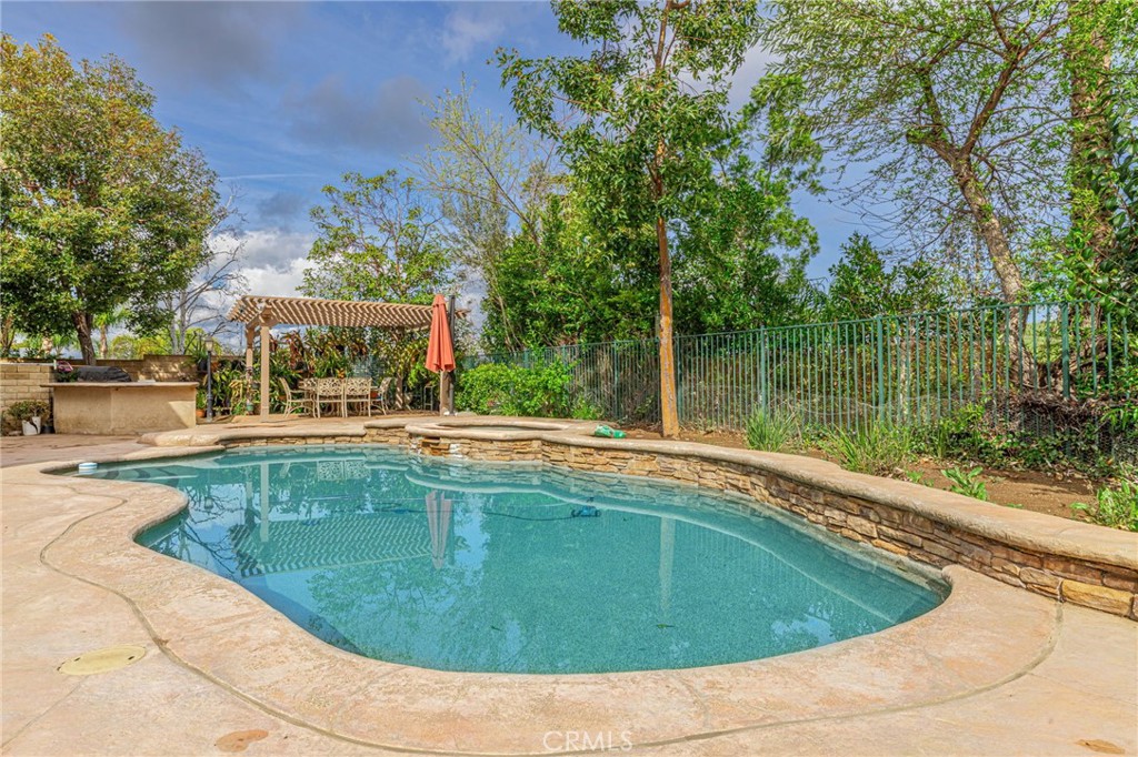 574 Oak Tree Court Simi Valley, CA 93065 - Photo 42 of 48 a view of a swimming pool with a patio