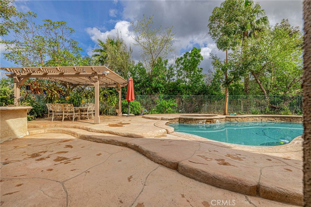 574 Oak Tree Court Simi Valley, CA 93065 - Photo 43 of 48 a view of a swimming pool with a patio