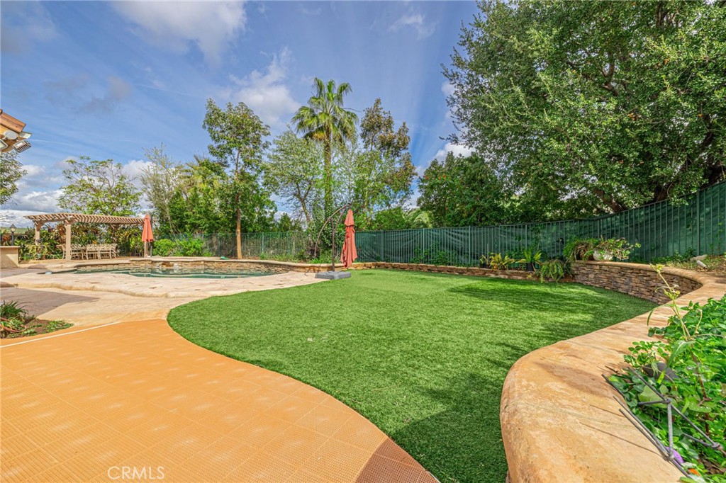 574 Oak Tree Court Simi Valley, CA 93065 - Photo 45 of 48 a view of a garden with a slide