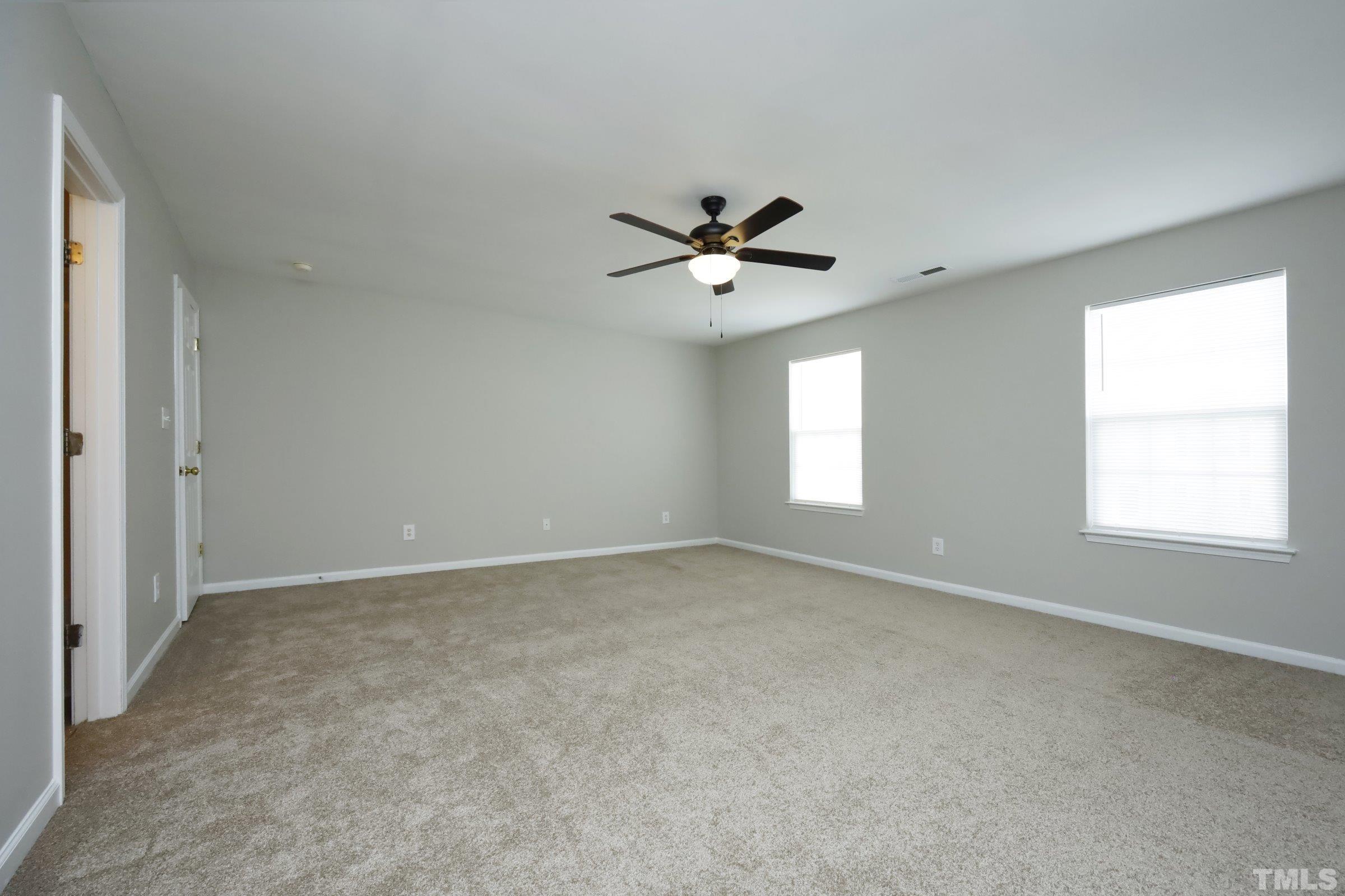 4014 Springfield Creek Drive Raleigh, NC 27616 - Photo 18 of 36 a view of an empty room with a window