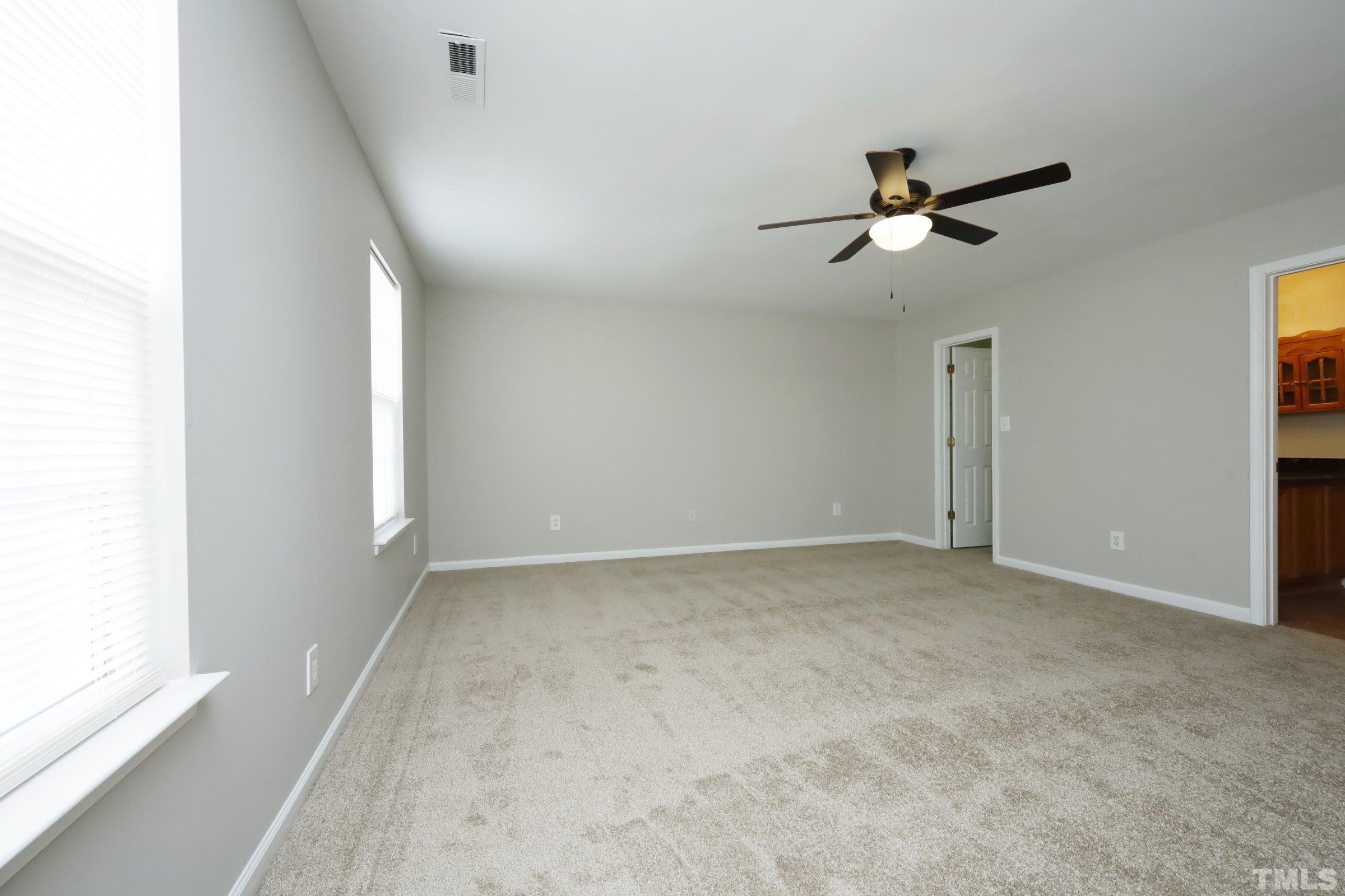 4014 Springfield Creek Drive Raleigh, NC 27616 - Photo 19 of 36 a view of an empty room