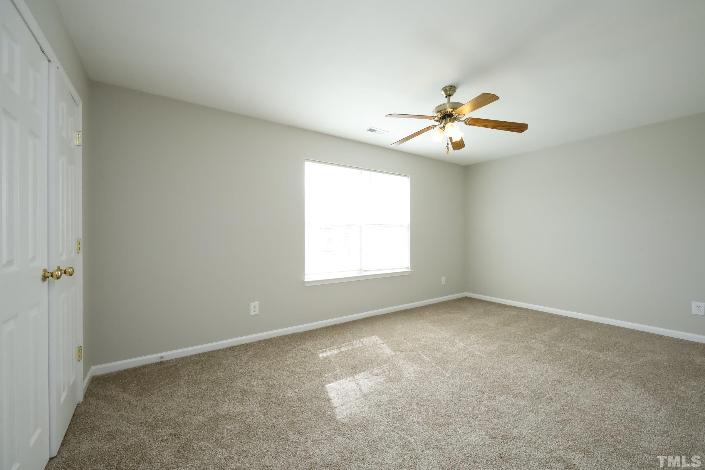 4014 Springfield Creek Drive Raleigh, NC 27616 - Photo 26 of 36 a view of room with a ceiling fan and a window