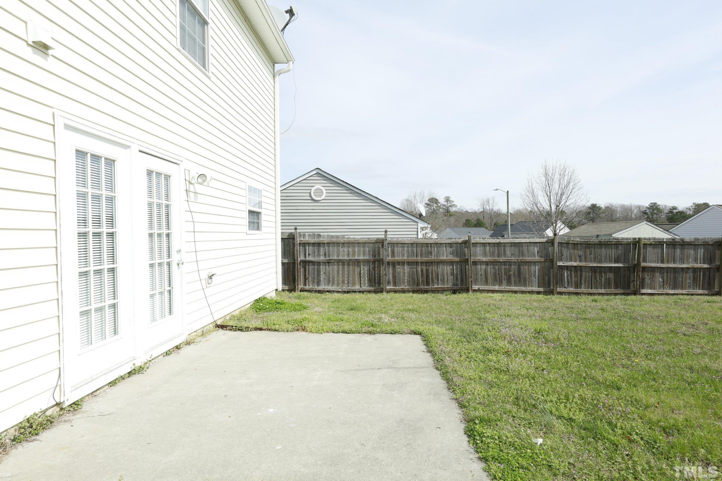 4014 Springfield Creek Drive Raleigh, NC 27616 - Photo 29 of 36 a view of backyard of house and wooden deck
