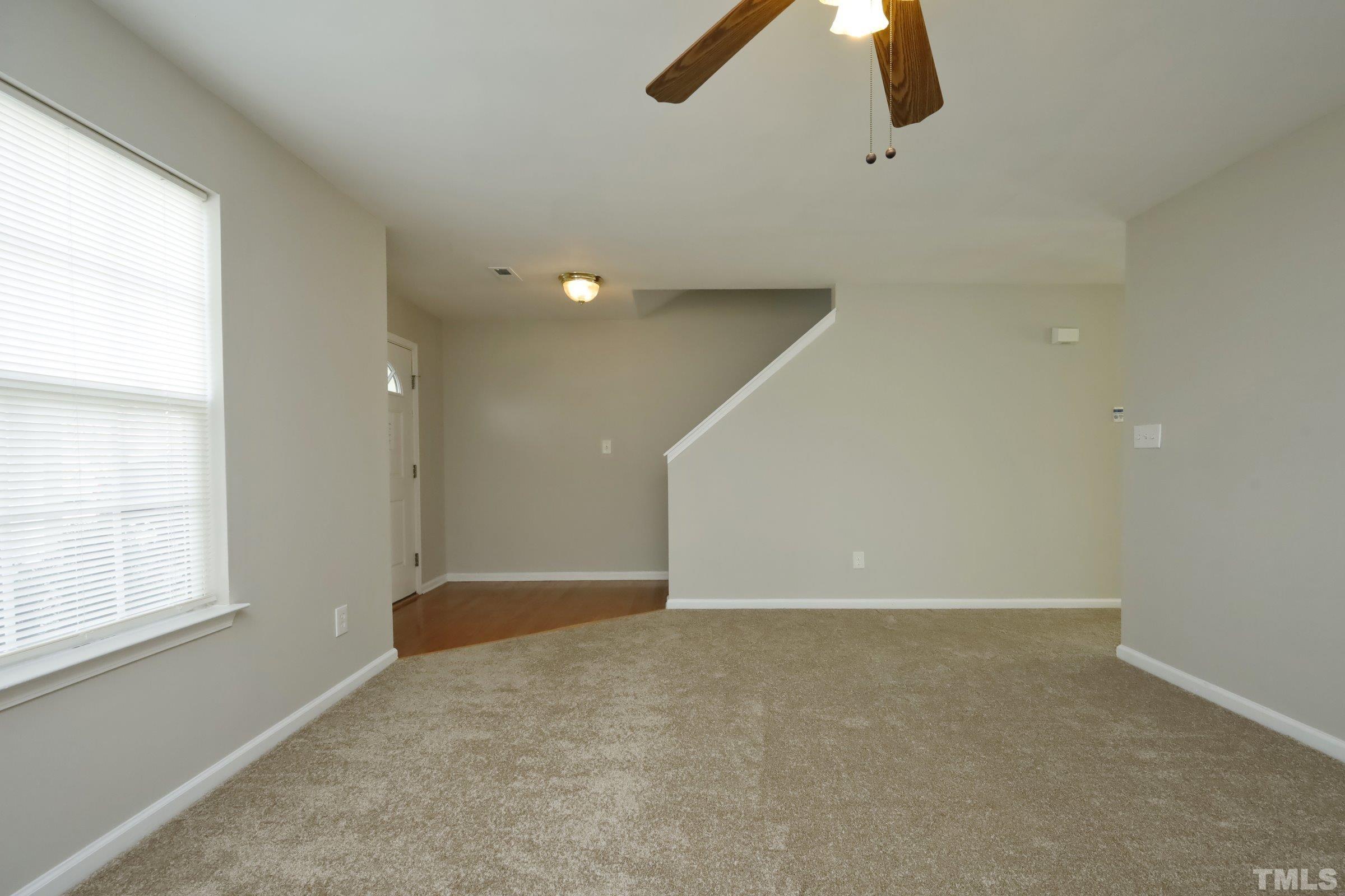 4014 Springfield Creek Drive Raleigh, NC 27616 - Photo 3 of 36 a view of an empty room with windows